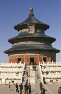 CHINA, Beijing, Temple of Heaven.  Hall of Prayer for Good Harvests and Chinese visitors posing for