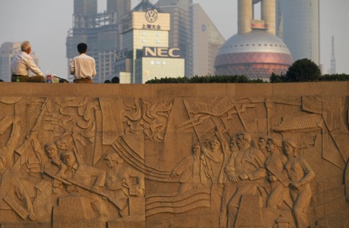 CHINA, Shanghai, The Martyr’s Monument.  Detail of relief carving with two men sitting on top of