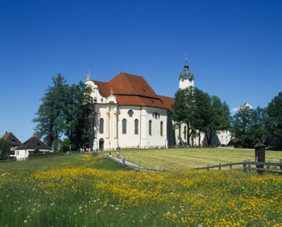 GERMANY, Bayern, General, Visitors on road to white painted church with red tile roof and domed