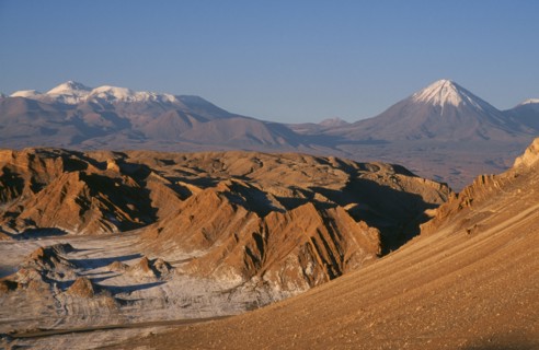 CHILE, Antofagasta, General, Salt deposits on desert surface near San Pedro de Atacama with snow