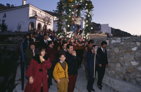 SPAIN, Andalucia, Festivals, Christmas procession through village carrying garlanded statue of the