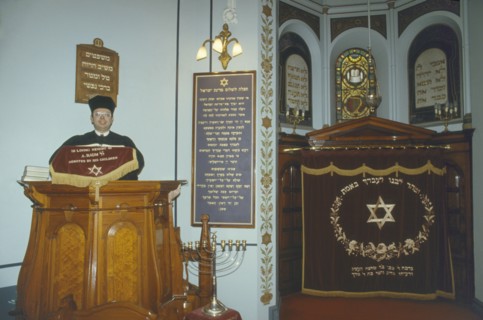 ENGLAND, Leicester, Interior of Leicester synagogue with Rabbi.
