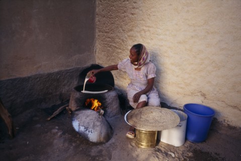 ERITREA, Keren, "Woman cooking injera, a type of sour, flat bread that accompanies most meals."