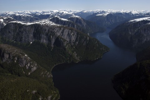 USA, Alaska, Misty Fjords Nat. Monument, Aerial view over river and surrounding rocky peaks