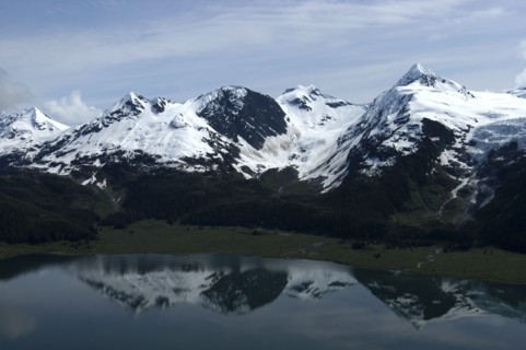 USA, Alaska, Prince William Sound, View over waters toward snow capped mountain peaks