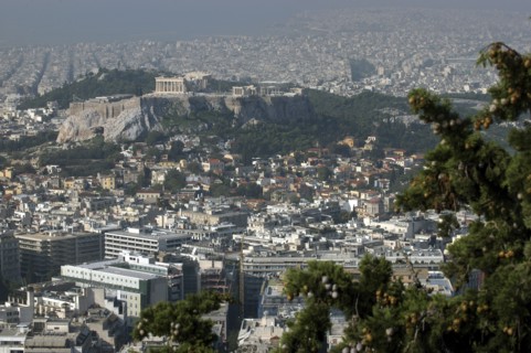 GREECE, Athens, Aerial view over the city toward the Acropolis