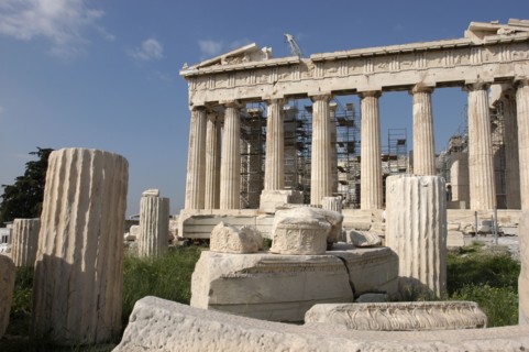 GREECE, Athens, Acropolis. View of the ruined Parthenon with smaller sections of columns in the