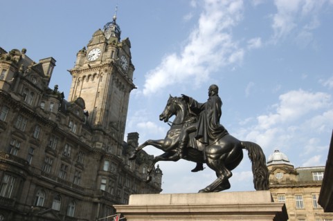 SCOTLAND, Lothian, Edinburgh, Angled view looking up at the Balmoral Hotel clocktower with