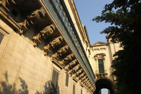 MALTA, Valletta , View along decorative architectural detail of enclosed balcony leading along the