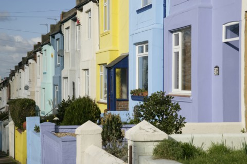ENGLAND, East Sussex, Brighton, Colourfully painted terraced housing in Bear Road.