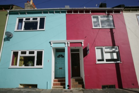 ENGLAND, East Sussex, Brighton, Brightly coloured terraced houses in Kemp Town