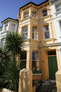 ENGLAND, East Sussex, Brighton, Brightly coloured terraced Kemp Town houses in Chesham Street