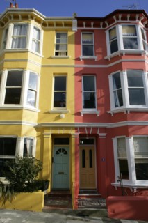 ENGLAND, East Sussex, Brighton, Brightly coloured terraced Kemp Town houses in Chesham Street
