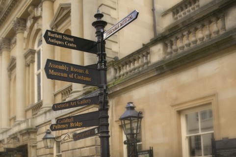 ENGLAND, Bath, Street signs outside the Pump Room.