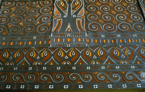 INDONESIA, Toraja, Detail of carving and painting in Toraja House.