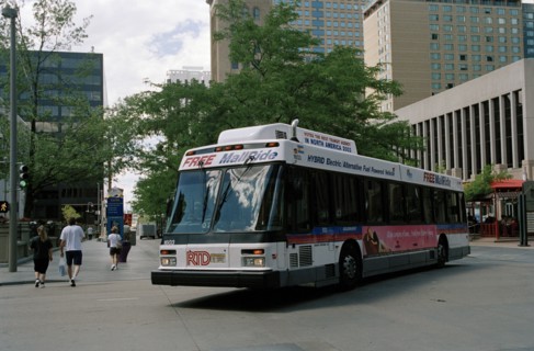 USA, Colorado, Denver, City bus turning street corner