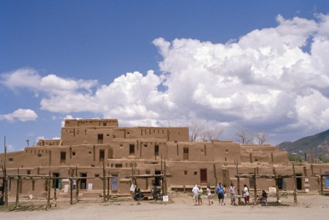 USA, Colorado, Taos Pueblo, Inhabited historical dwellings with tourists outside