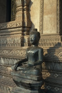 LAOS, Vientiane, Haw Pha Kaew Temple.  Seated Buddha figure.