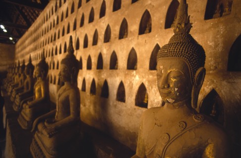 LAOS, Vientiane, Wat Si Saket.  Detail of Buddha figures in temple interior.