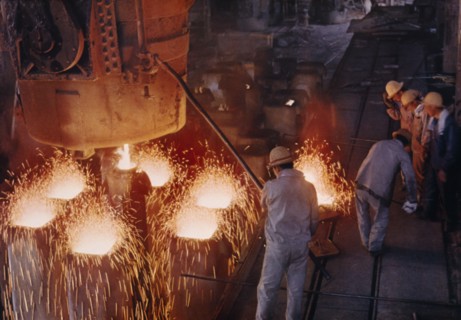 CHINA, Liaoning, Anshan, Interior of steel works with male workers.