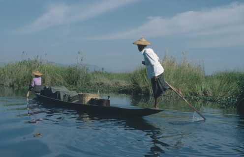 MYANMAR, Transport, Fishing boat rowed by oarsman using one leg.