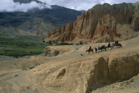 NEPAL, Mustang, Drakhmar , High ranking Tibetan lama and attending monks leaving Drakhmar on