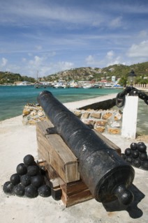 WEST INDIES, St Vincent & The Grenadines, Union Island, Ancient canon on the harbourside at Clifton
