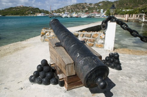 WEST INDIES, St Vincent & The Grenadines, Union Island, Ancient canon on the harbourside at Clifton