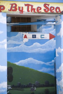 WEST INDIES, St Vincent & The Grenadines, Union Island, Wall painting in Clifton depicting a woman