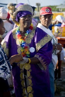 WEST INDIES, St Vincent & The Grenadines, Union Island, Woman handing out food amongst the Baptist