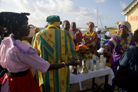 WEST INDIES, St Vincent & The Grenadines, Union Island, Women handing out donated goods amongst the