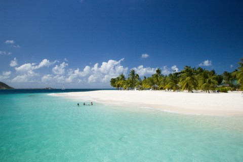 WEST INDIES, St Vincent & The Grenadines, Palm Island, The beach at Palm Island Resort with guests