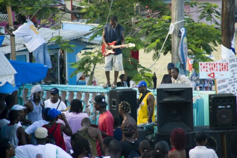 WEST INDIES, St Vincent & The Grenadines, Union Island, Guitarist and sound system at Easterval