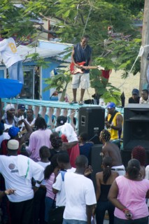 WEST INDIES, St Vincent & The Grenadines, Union Island, Guitarist and sound system at Easterval