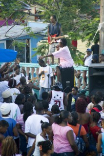 WEST INDIES, St Vincent & The Grenadines, Union Island, Singer and guitarist with sound system at