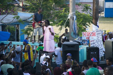 WEST INDIES, St Vincent & The Grenadines, Union Island, Singer and guitarist with sound system at