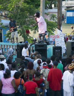 WEST INDIES, St Vincent & The Grenadines, Union Island, Singer and guitarist with sound system at