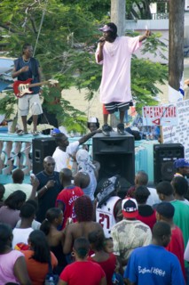 WEST INDIES, St Vincent & The Grenadines, Union Island, Singer and guitarist with sound system at