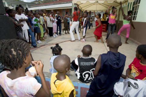 WEST INDIES, St Vincent & The Grenadines, Union Island, Children watching other children dancing to