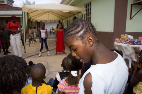 WEST INDIES, St Vincent & The Grenadines, Union Island, Children watching other children dancing to