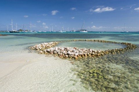 WEST INDIES, St Vincent & The Grenadines, Union Island, Conch shell structures on the beach at