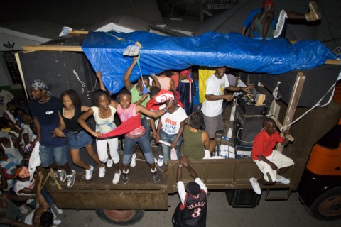 WEST INDIES, St Vincent & The Grenadines, Union Island, Mobile sound system and dancers on a truck