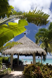 WEST INDIES, St Vincent & The Grenadines, Canouan, Palapa thatched entrance from hotel jetty at