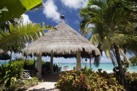 WEST INDIES, St Vincent & The Grenadines, Canouan, Palapa thatched entrance from hotel jetty at