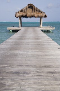 WEST INDIES, St Vincent & The Grenadines, Canouan, The jetty on Jambu Beach at Raffles Resort