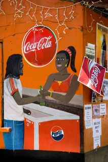 WEST INDIES, St Vincent & The Grenadines, Bequia, Wall painting on a bar depicting woman selling