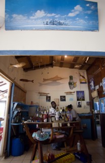 WEST INDIES, St Vincent & The Grenadines, Bequia, Bar and staff at beachside restaurant on Lower