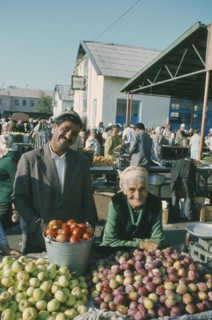 KIRGHIZSTAN, Frunze, Elderly stallholders selling fruit at market.