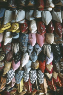 MOROCCO, Fes, Display of embroidered and decorated leather slippers or babouches.