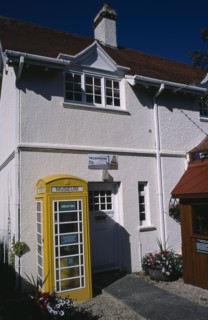 UNITED KINGDOM, Channel Islands, Guernsey, Castel. Telephone museum. Traditional yellow phone box